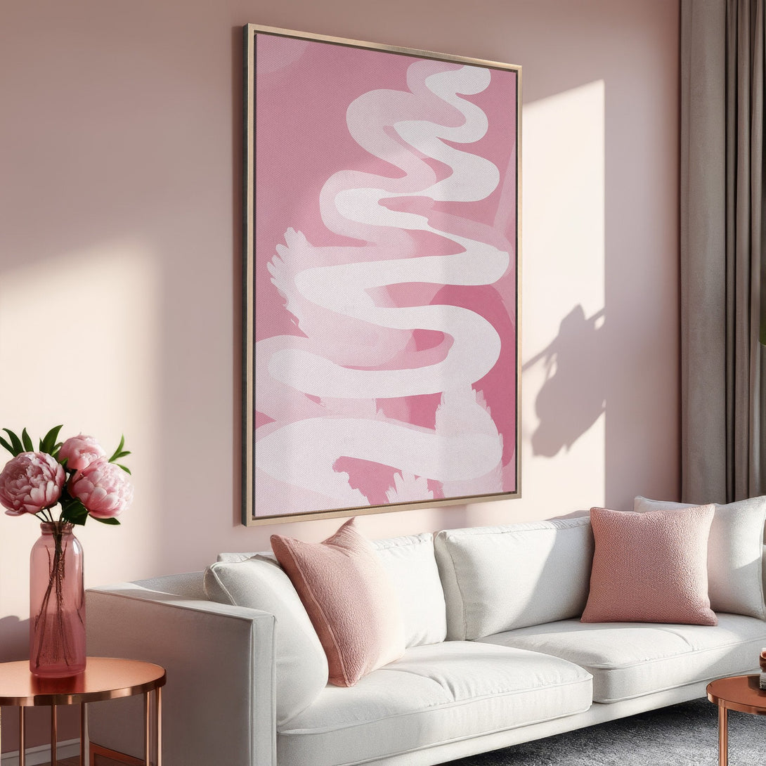 Framed Wall Art: Abstract pink and white artwork in a modern living room. Soft, feminine color palette perfect for adding a touch of elegance.