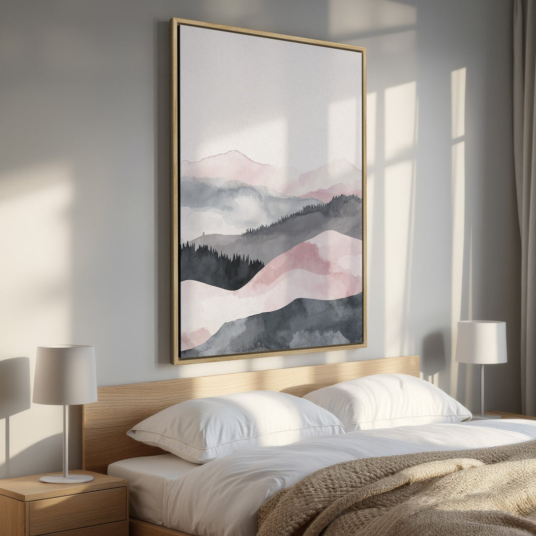 Framed Wall Art featuring a watercolor mountain landscape in soft pink, gray, and black hues. Perfect for bedroom decor and adding a touch of serenity.