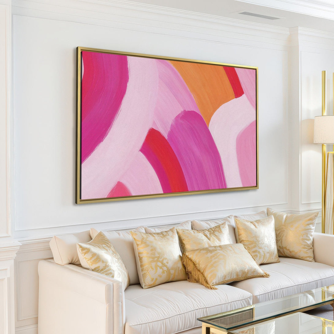 Abstract Canvas Print in a modern living room. Features a pink, orange, and white color palette. Perfect for adding a pop of color!