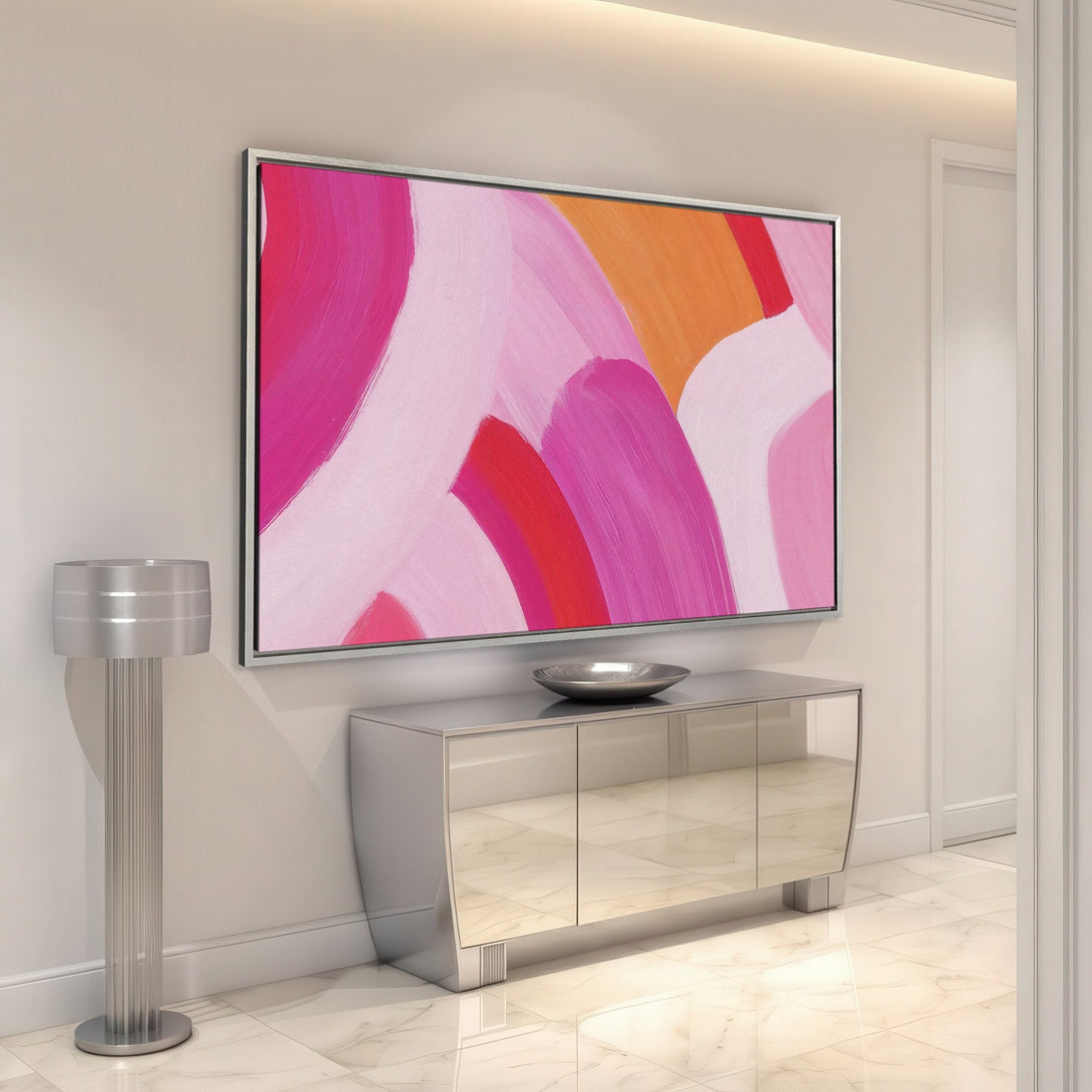 Framed Wall Art featuring abstract brushstrokes in a vibrant pink and orange color palette. Modern art for a stylish interior.
