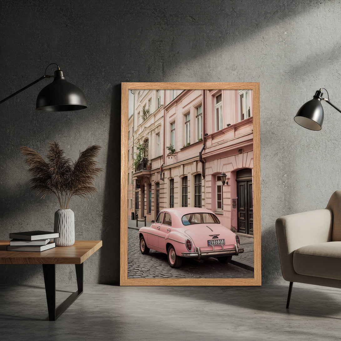 Framed Poster featuring a vintage pink car on a cobblestone street. Stylish, pastel color palette with a retro aesthetic. Perfect wall art!
