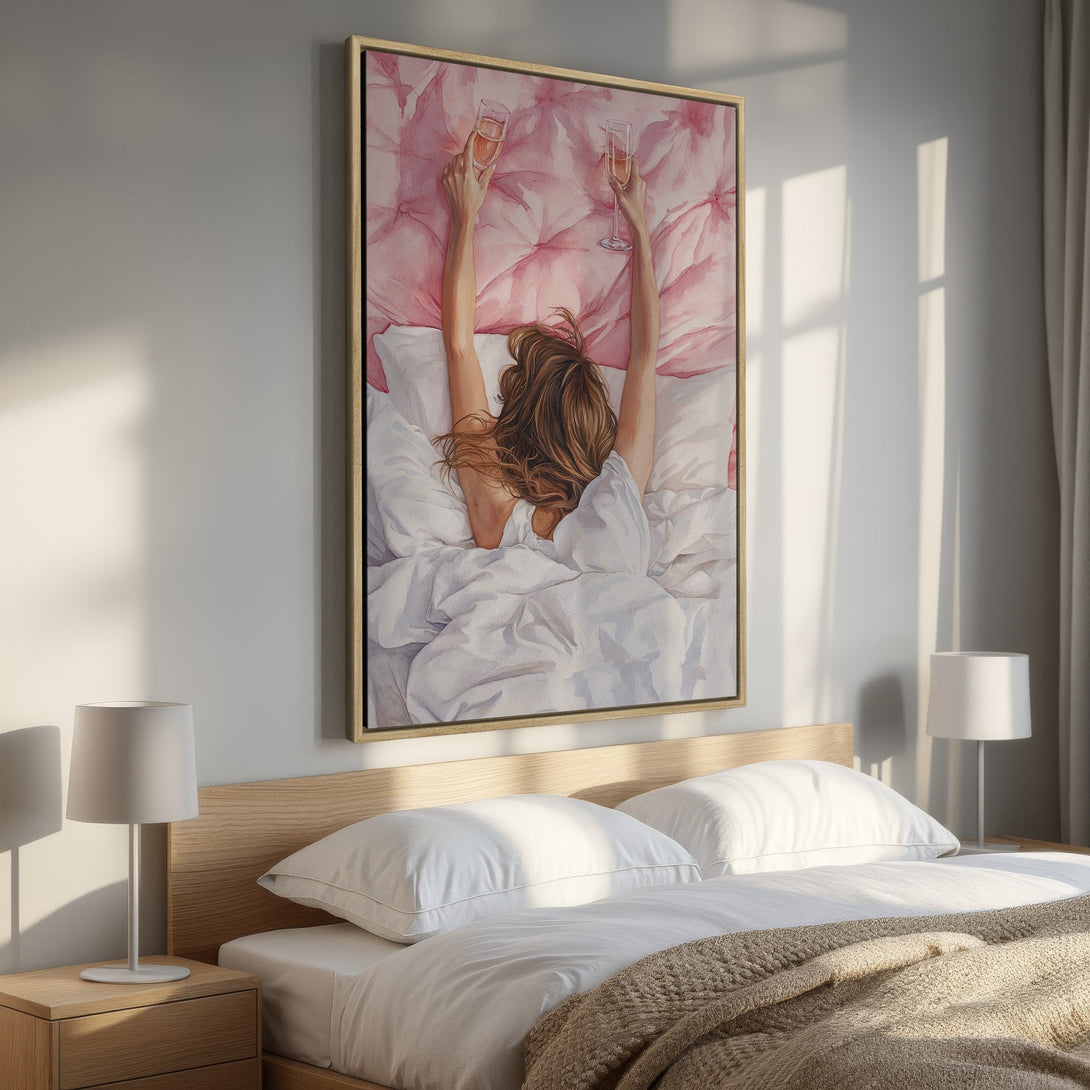 Framed Wall Art: Watercolor painting of woman in bed with champagne, soft pink and white palette. Perfect bedroom decor for a touch of elegance.