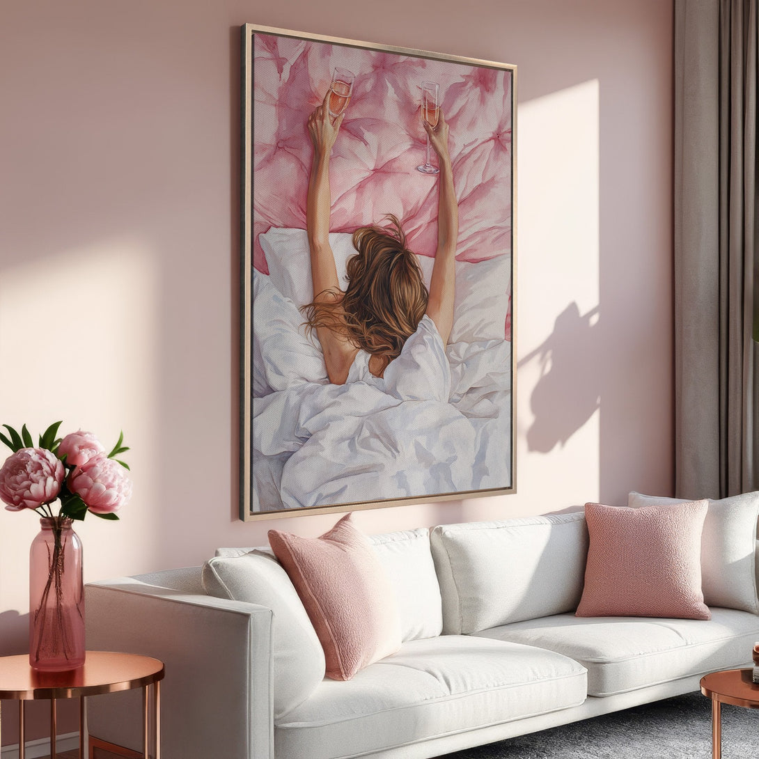 Framed Wall Art: Woman in bed with champagne, watercolor style. Soft pink color palette creates a relaxing vibe. Perfect for bedroom decor.