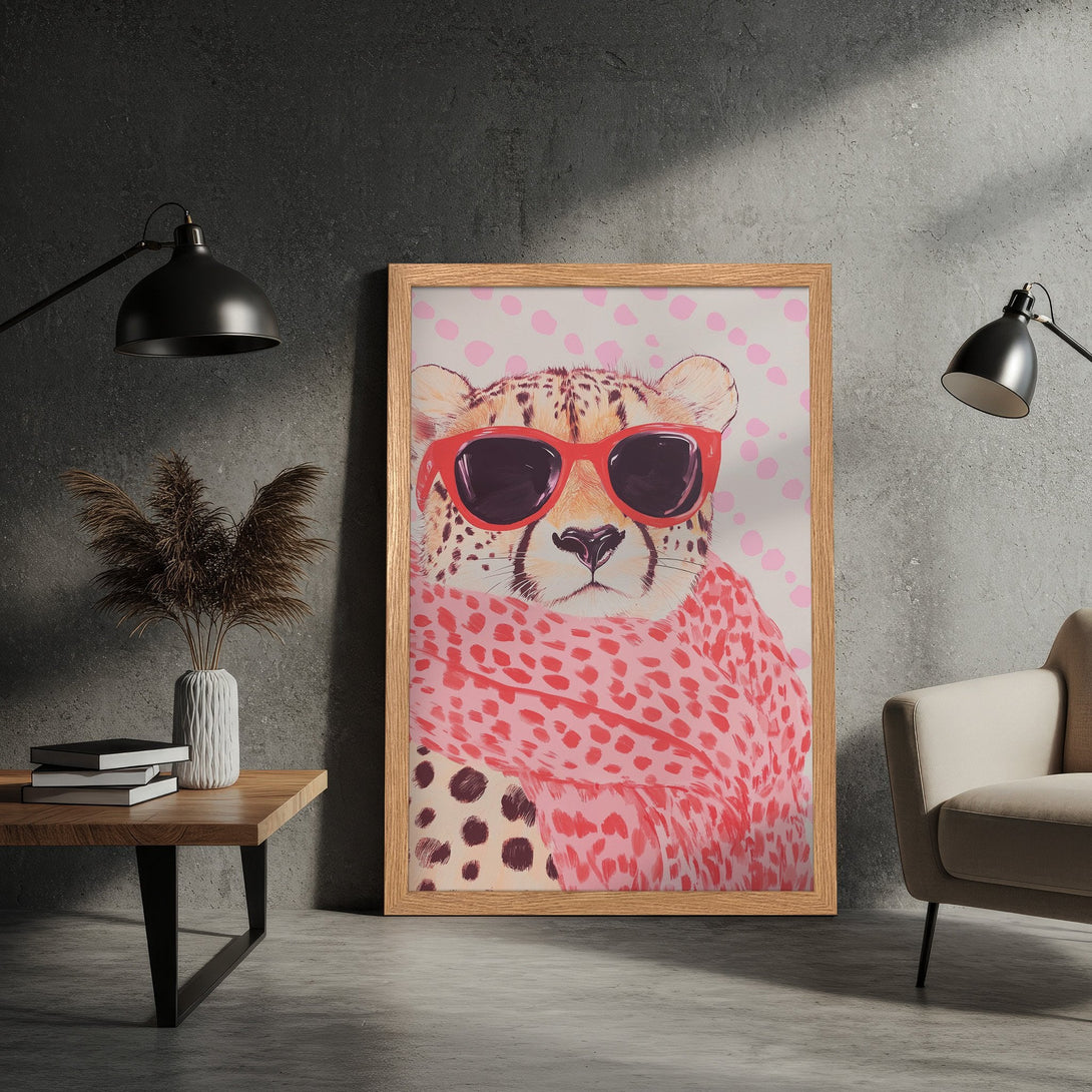 Framed Poster featuring a cheetah with sunglasses and scarf, pop art style, pink and neutral color palette. Add a touch of fun to your space!