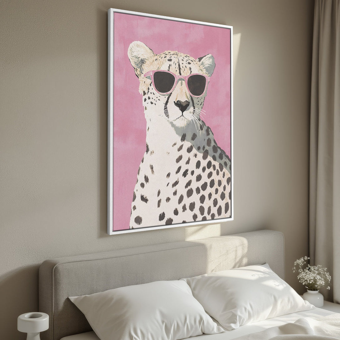 Framed Wall Art: Funky cheetah portrait with pink sunglasses on a pink background. Modern pop art style with a neutral and pink color palette.