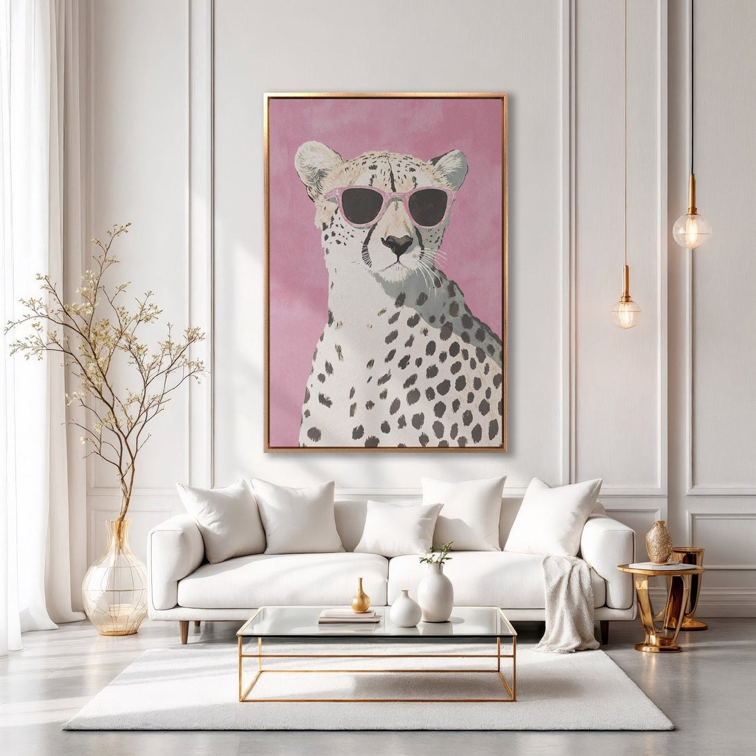 Framed Wall Art: Stylish cheetah print with pink sunglasses. Modern decor in a chic living room with a pink, white, and gold color palette. Perfect for a trendy home.