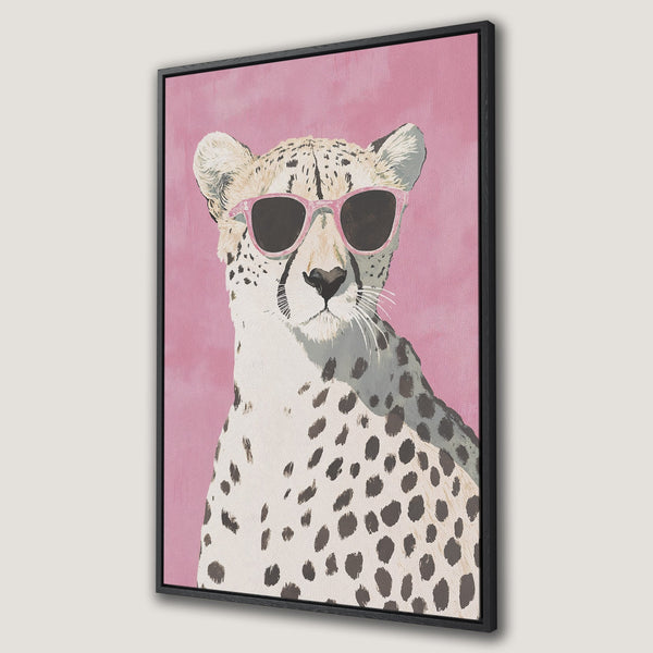 Framed Wall Art featuring a cool cheetah wearing pink sunglasses against a pink background. Modern, stylish decor in a fun, playful color palette.