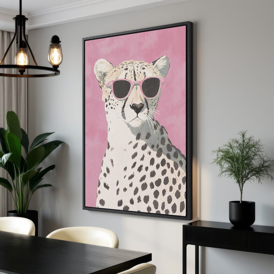 Framed Wall Art: Cool cheetah wearing sunglasses on a pink background. Modern, pop art style with a neutral and pink color palette. Perfect for home decor.
