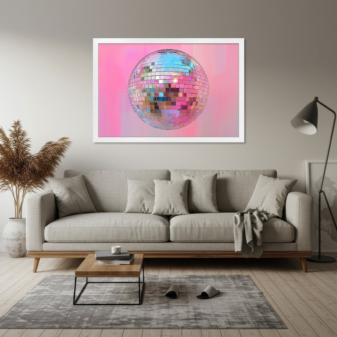Framed Poster featuring a disco ball against a pink backdrop. Modern style, vibrant colors add a pop of fun to any space. Get yours today!