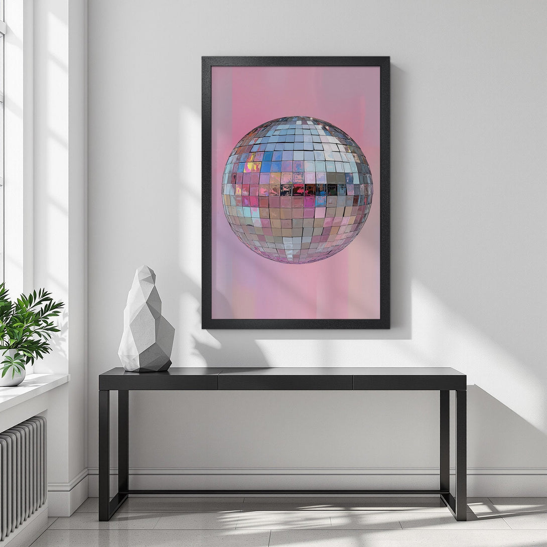 Framed Poster featuring a disco ball on a pink background. Modern style with a pastel color palette, perfect for adding a touch of fun to your space.