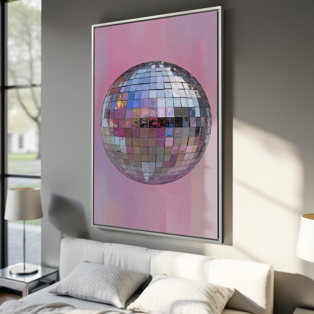 Framed Wall Art featuring a disco ball against a pink background. Modern art with a pop of color, perfect for bedroom decor.