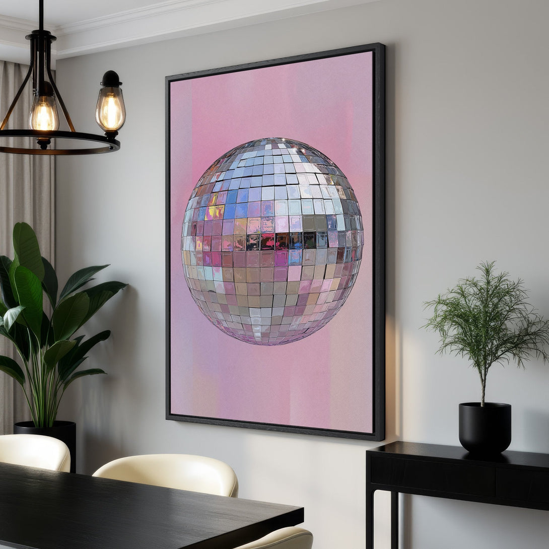 Framed Wall Art featuring a disco ball on a pink background. Modern, abstract style with a soft, pastel color palette. Perfect for adding a touch of retro flair!