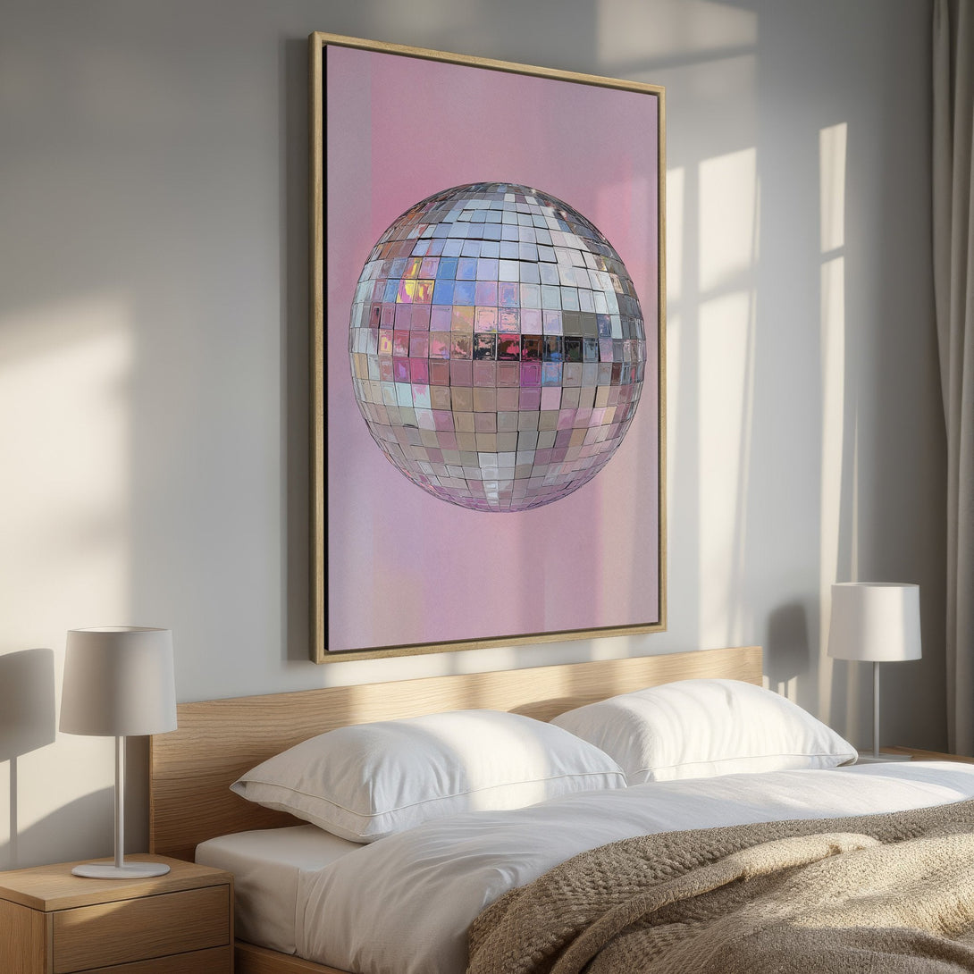 Framed Wall Art featuring a disco ball on a pink background. Modern art with a pastel color palette, perfect for bedroom decor.