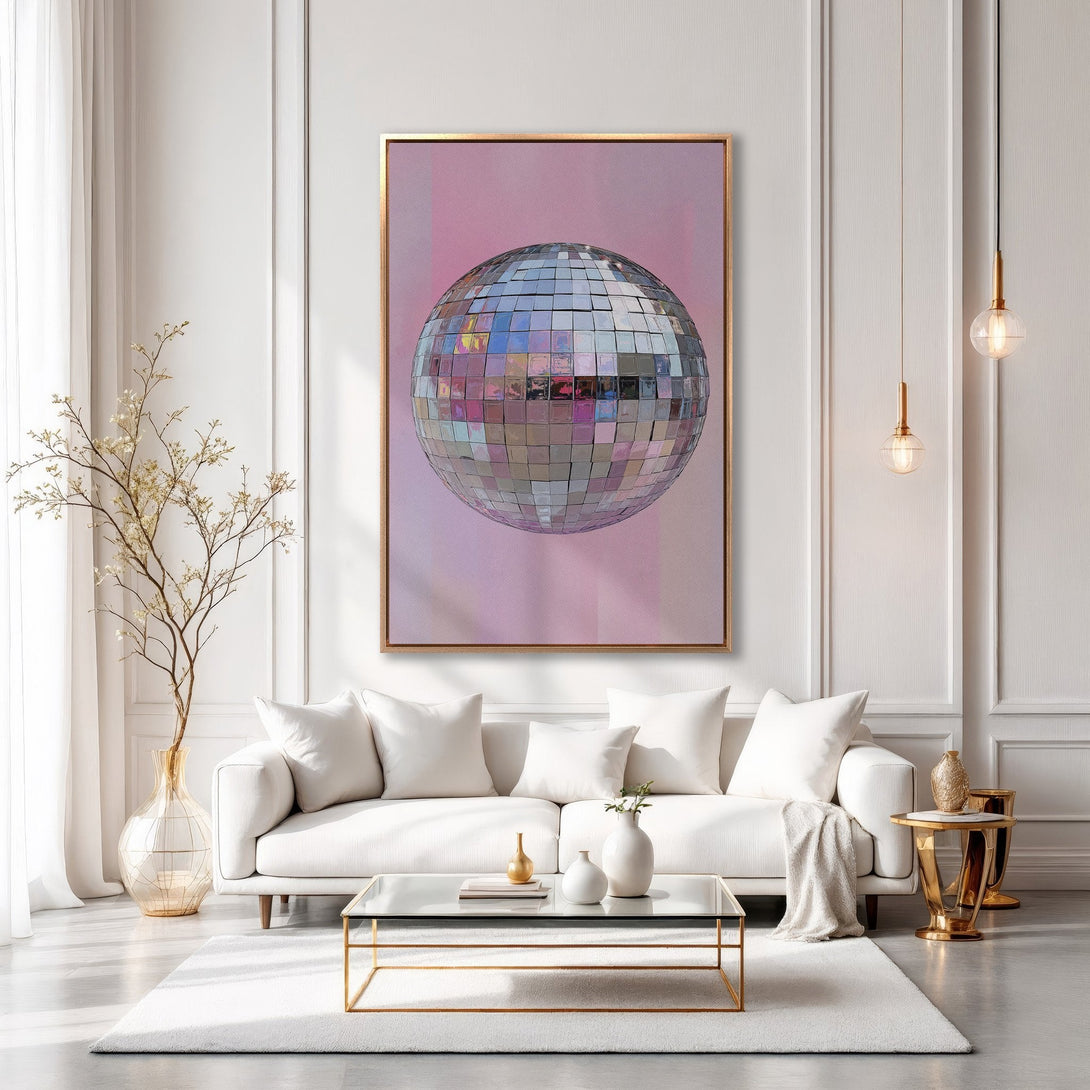 Framed Wall Art: Disco ball print in a modern interior. Pink and silver tones with gold frame and accents. Elevate your space with this stylish artwork.