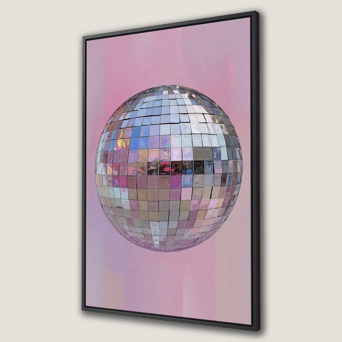 Framed Wall Art featuring a disco ball against a pink and purple backdrop. Add a touch of retro glam to your space with this stylish canvas print!