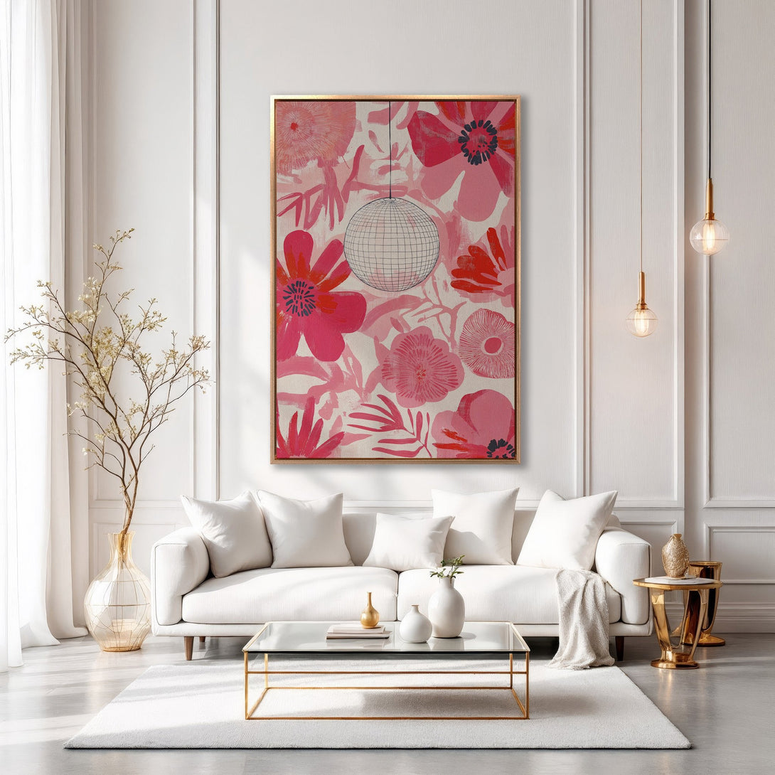 Framed Wall Art featuring a bold floral design in pink and red hues. Modern, stylish interior decor with a disco ball accent. Perfect for adding a pop of color!