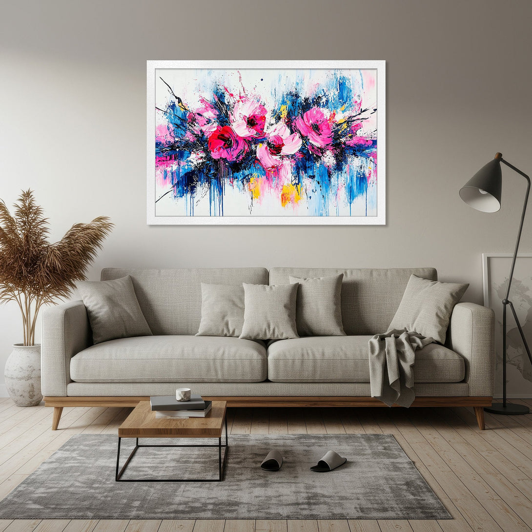 Framed Poster featuring abstract floral art in pink, blue, and yellow. Modern wall decor for a stylish home.