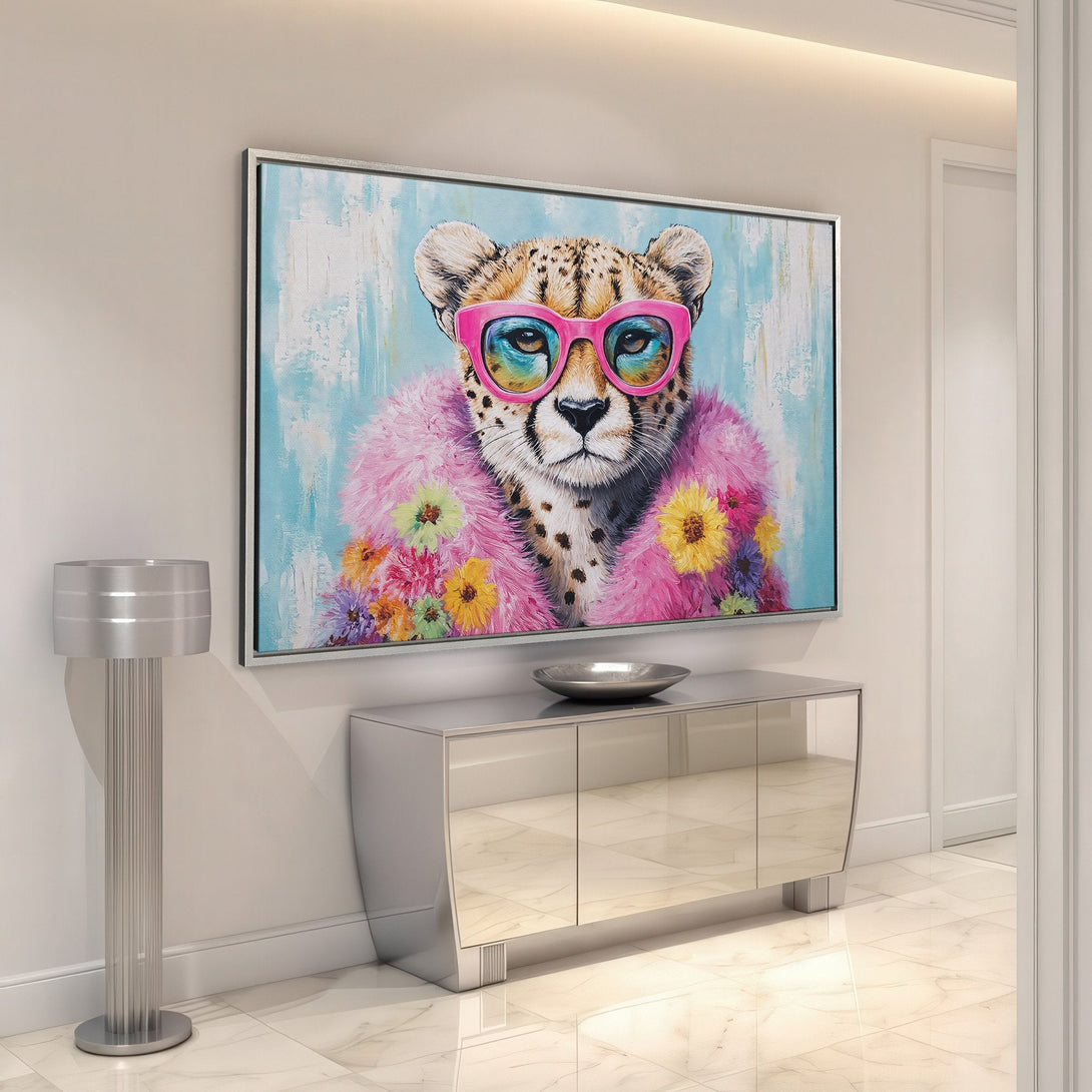 Framed Wall Art: Playful cheetah portrait with pink glasses and fur, vibrant floral accents. Modern art with a pastel blue and pink color palette. Add a pop of fun!