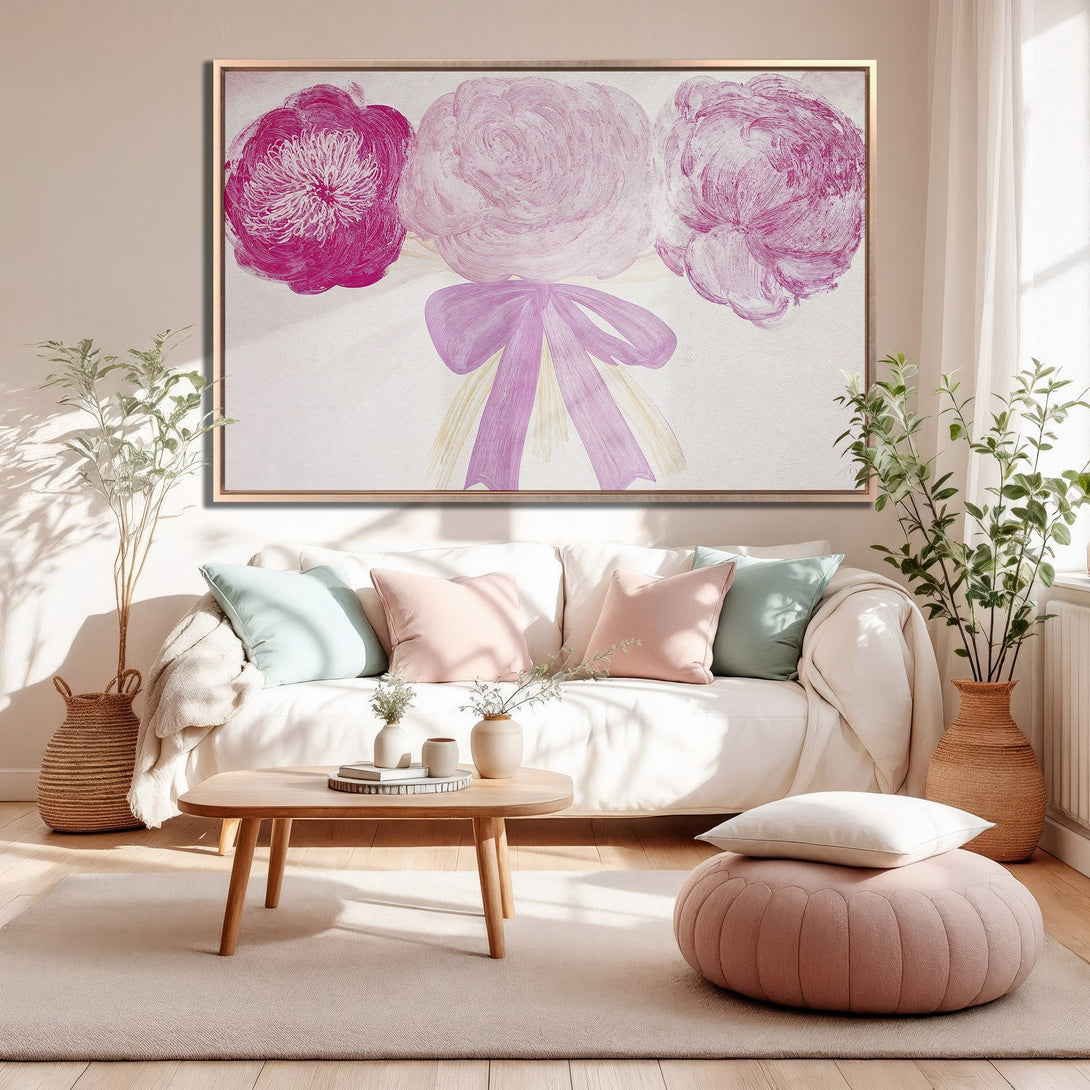Framed Wall Art featuring abstract floral painting in pink hues. Modern canvas print adds a pop of color to any living room.