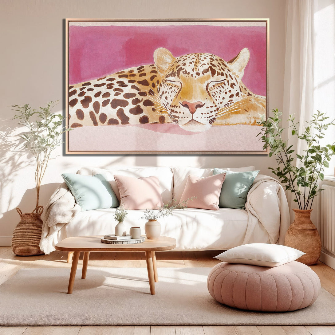 Framed Wall Art featuring a sleeping leopard in watercolor style, warm pink and tan color palette, perfect for adding a touch of elegance to your home decor.