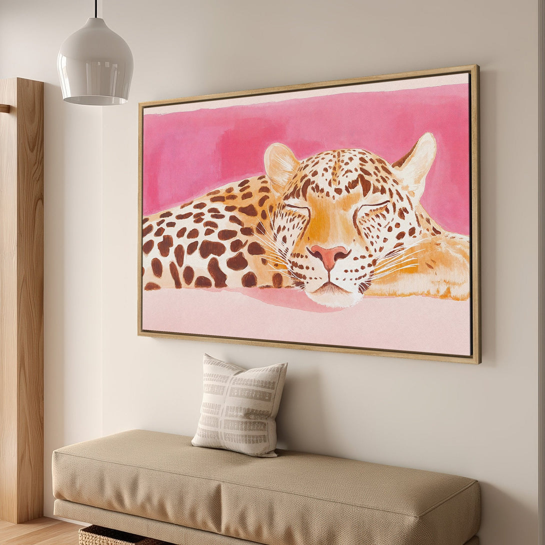 Framed Wall Art featuring a sleeping leopard in a watercolor style with a pink and brown color palette, perfect for adding a touch of elegance.