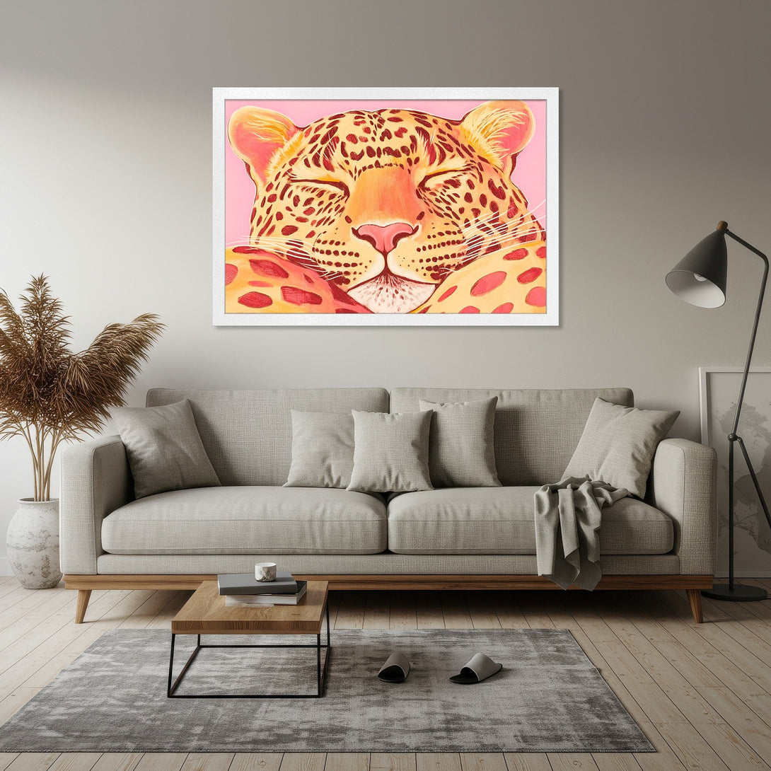 Framed Poster featuring a sleeping leopard in a pop art style with a pink and orange color palette. Add a touch of wild to your decor!