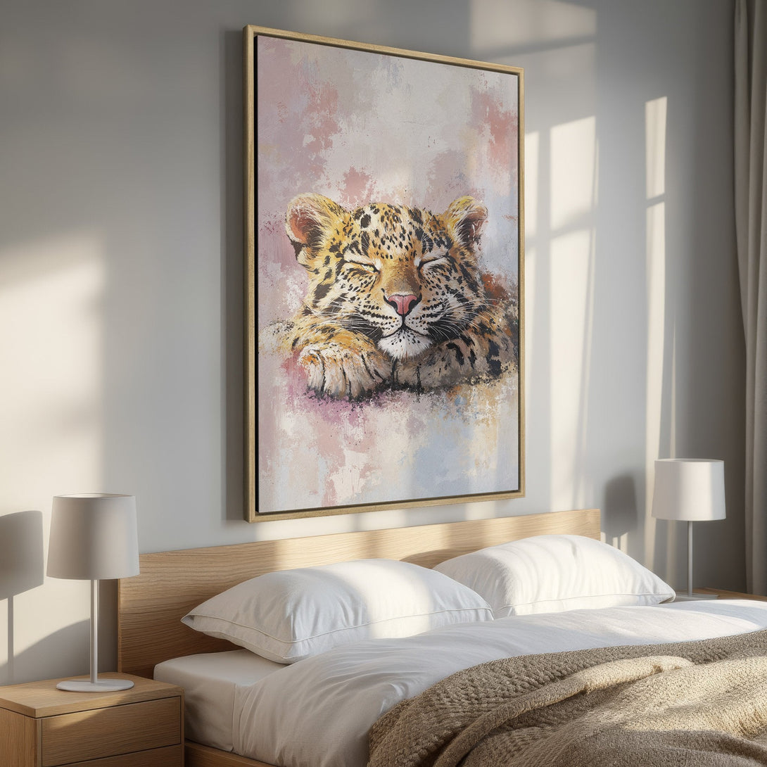 Framed Wall Art of a sleeping leopard cub in soft, watercolor style. Warm, neutral tones with pops of pink and gold. Perfect for a cozy bedroom.