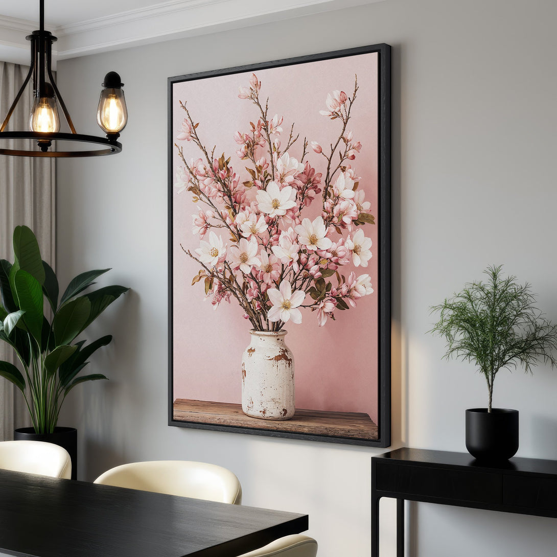 Framed Wall Art featuring delicate pink and white floral arrangement on a soft pink background. Adds a touch of elegance to any space.