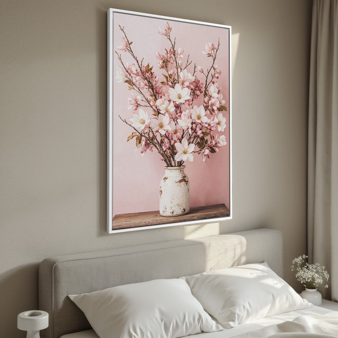 Framed Wall Art: Floral Canvas Print in soft pink and white tones. Elegant botanical art for bedroom decor. Adds a touch of serenity and style.