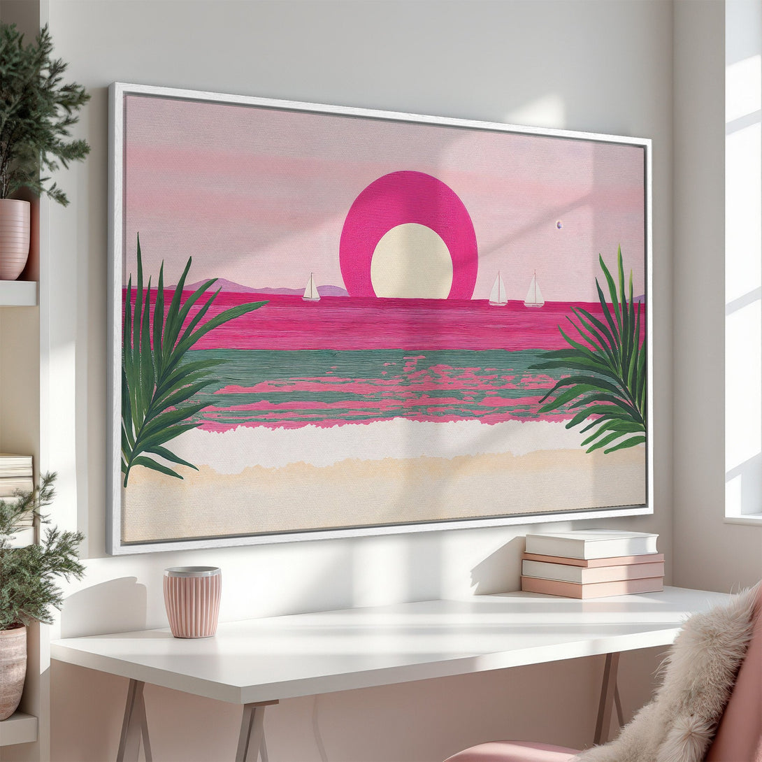 Framed Wall Art of a vibrant sunset over the ocean with sailboats. Pink and green color palette, perfect for coastal decor. Add a pop of color to your space!