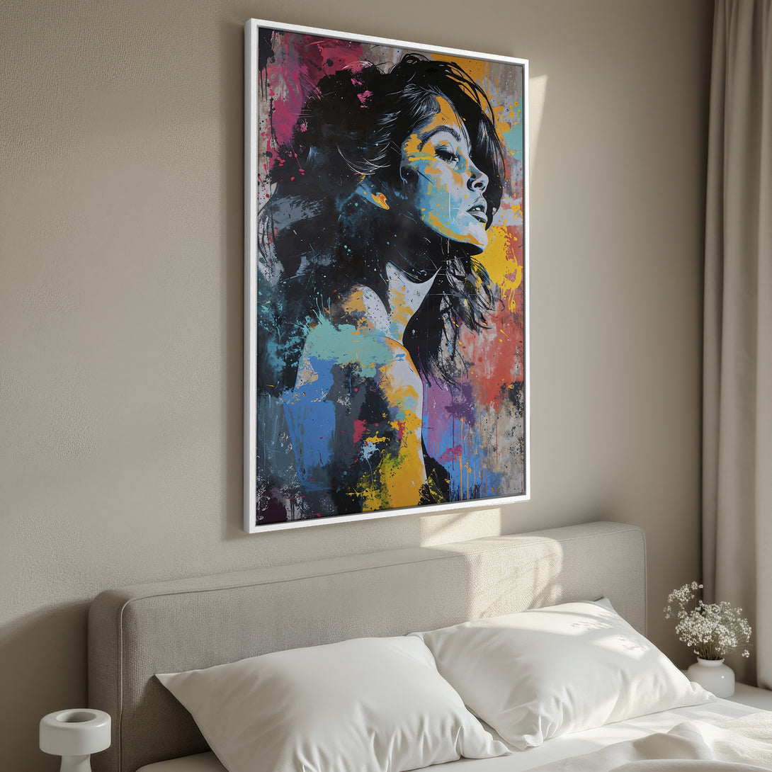 Framed Wall Art: Abstract portrait of a woman with a vibrant, colorful paint splatter style. Modern art with a bold blue, yellow, and pink palette.