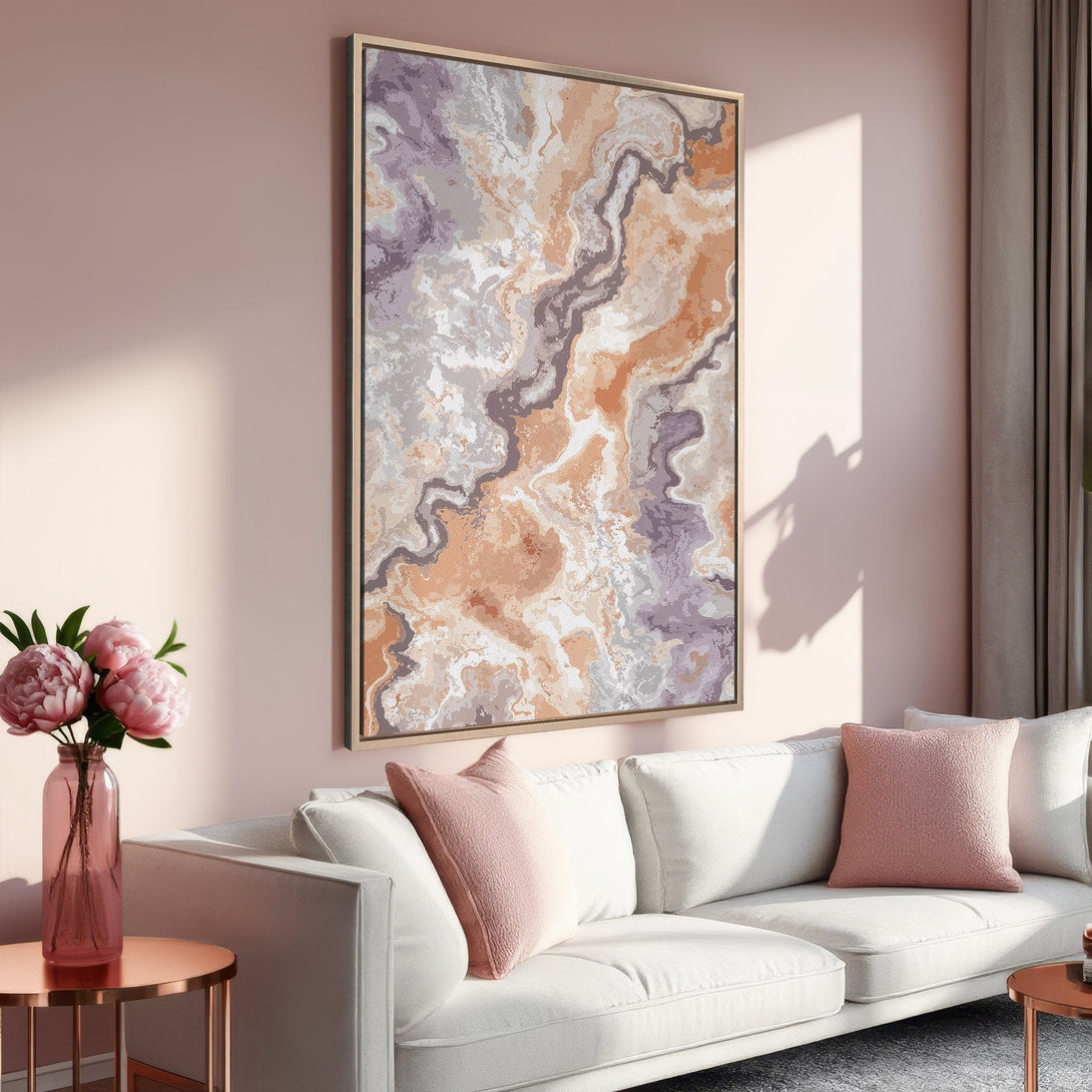 Framed Wall Art featuring an abstract marble design in warm peach, gray, and purple tones, displayed in a modern living room setting.