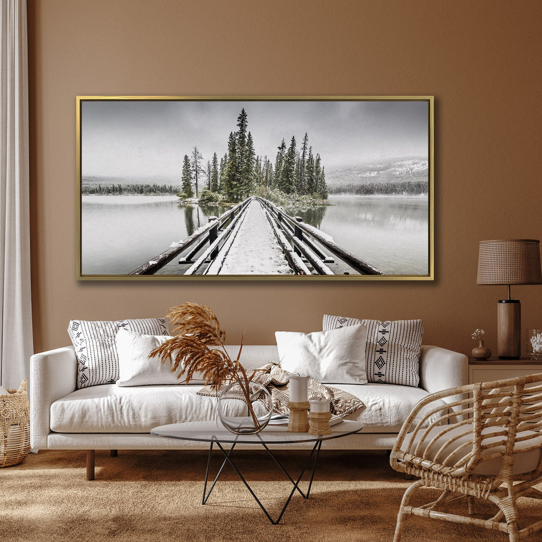 Canvas Print of a snowy bridge leading to an island, serene landscape art in cool gray and green tones. Perfect wall decor.