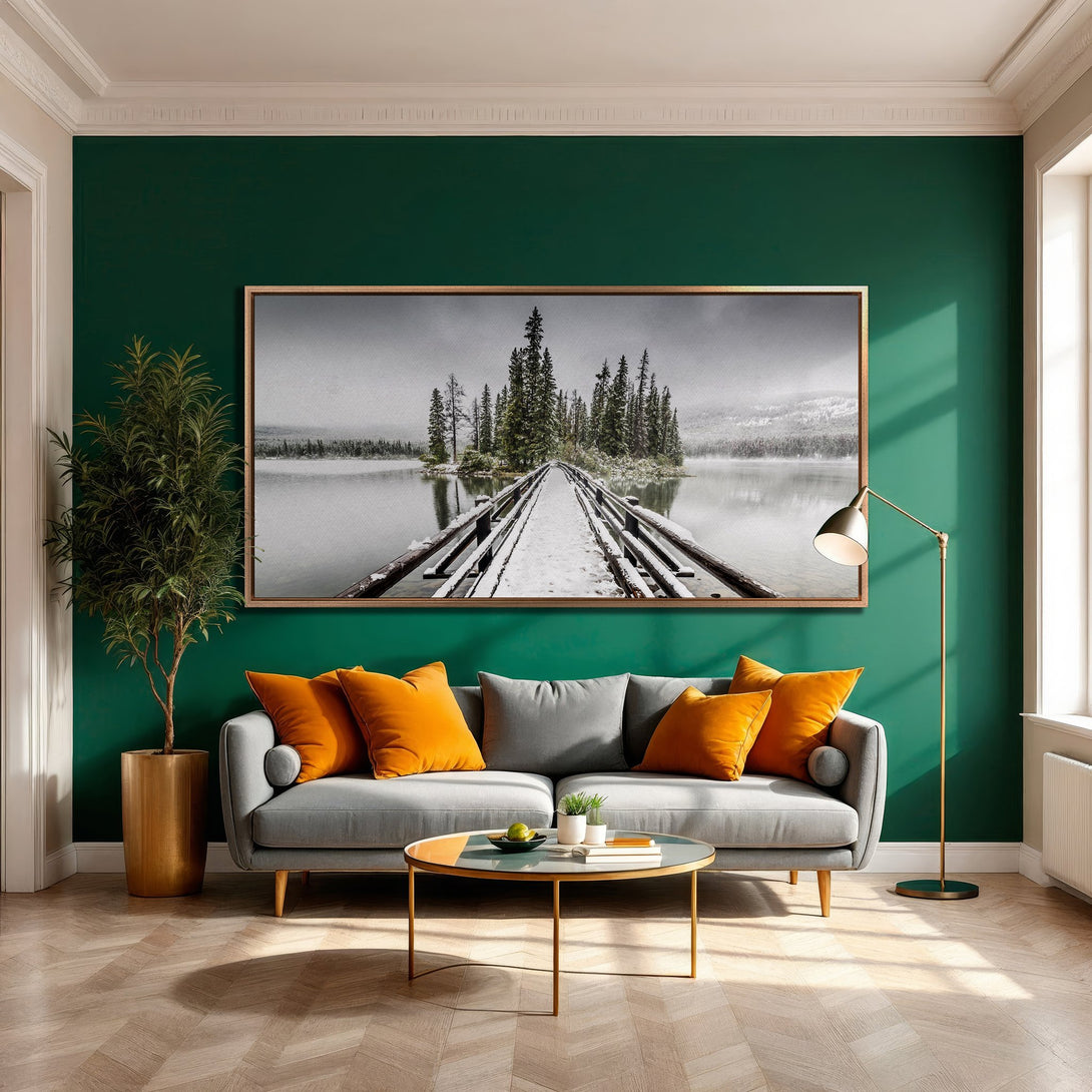 Framed Wall Art: Serene landscape Canvas Print in a modern interior. Features a snowy bridge scene with a neutral palette, pops of orange, and a green accent wall.