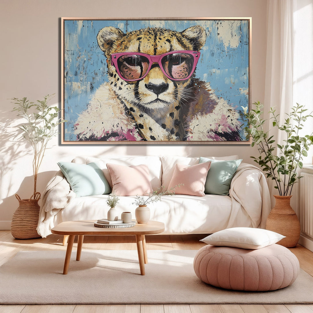 Framed Wall Art: Cool cheetah wearing pink sunglasses, modern pop art style. Pastel blue, pink, and neutral tones. Perfect for adding personality to your space!