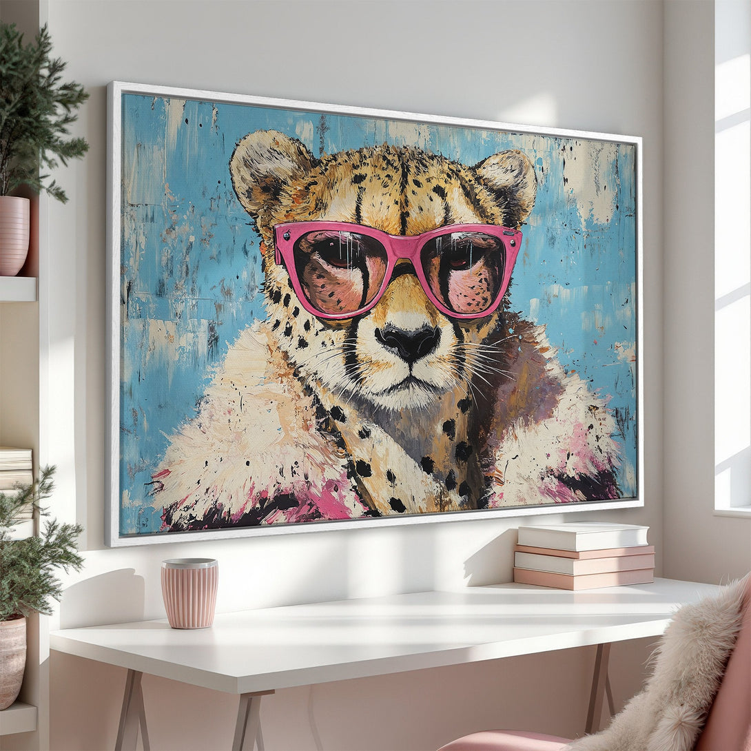 Framed Wall Art: Stylish cheetah portrait with pink sunglasses, vibrant blue and pink abstract background. Add a touch of cool to your space!