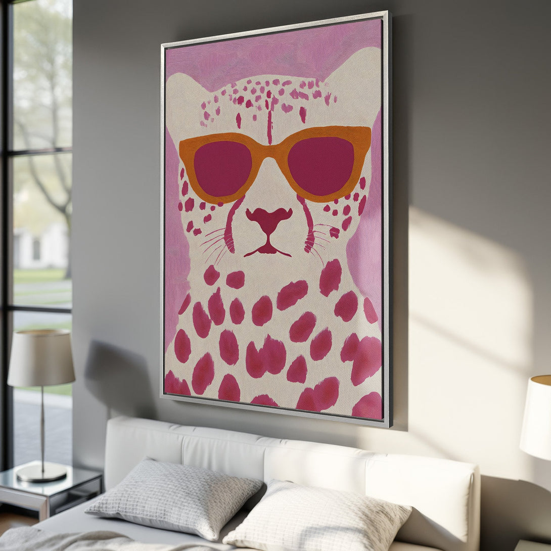 Framed Wall Art featuring a cool cheetah wearing sunglasses, pop art style, pink and orange color palette. Add a touch of fun to your home!