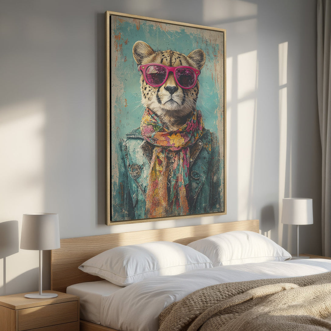Framed Wall Art: Stylish cheetah portrait with pink sunglasses and colorful scarf, displayed in a bedroom. Vintage style with teal, brown, and pink tones.
