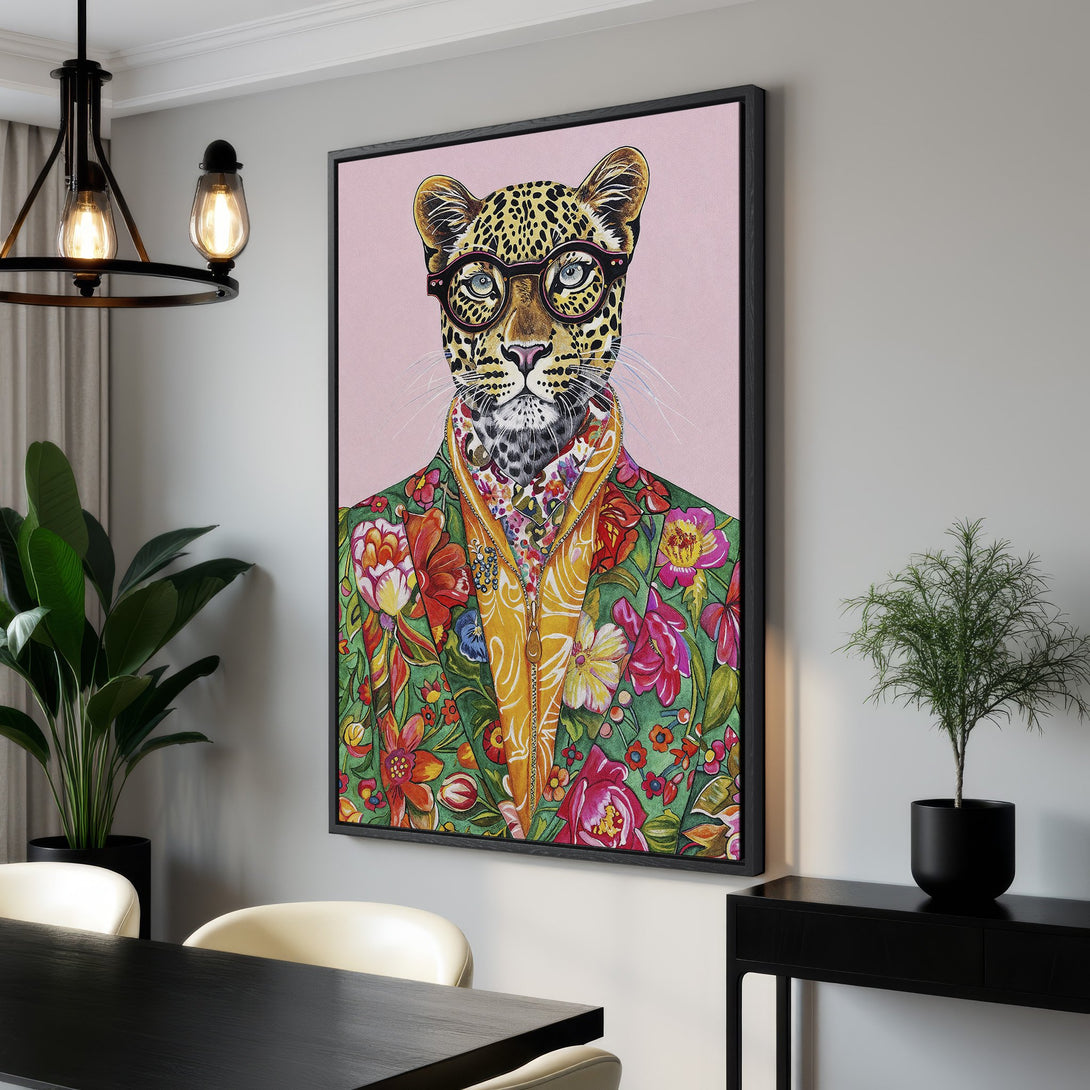Framed Wall Art: Stylish leopard portrait with glasses & floral jacket. Vibrant colors pop against a pink background. Add personality to your space!