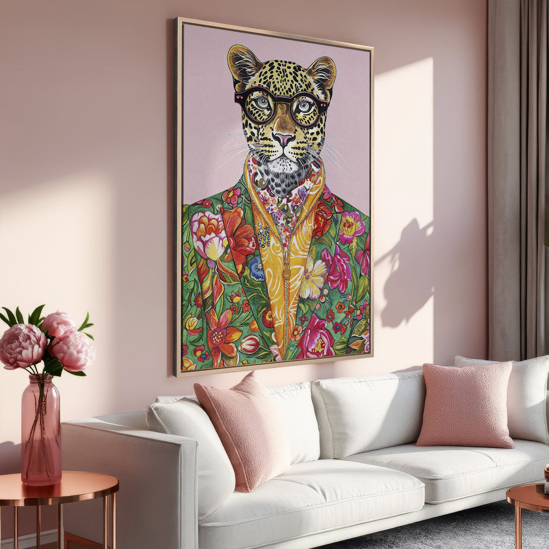 Framed Wall Art: Stylish leopard portrait with glasses and floral jacket, displayed in a modern living room. Pink and green color palette, perfect for home decor.