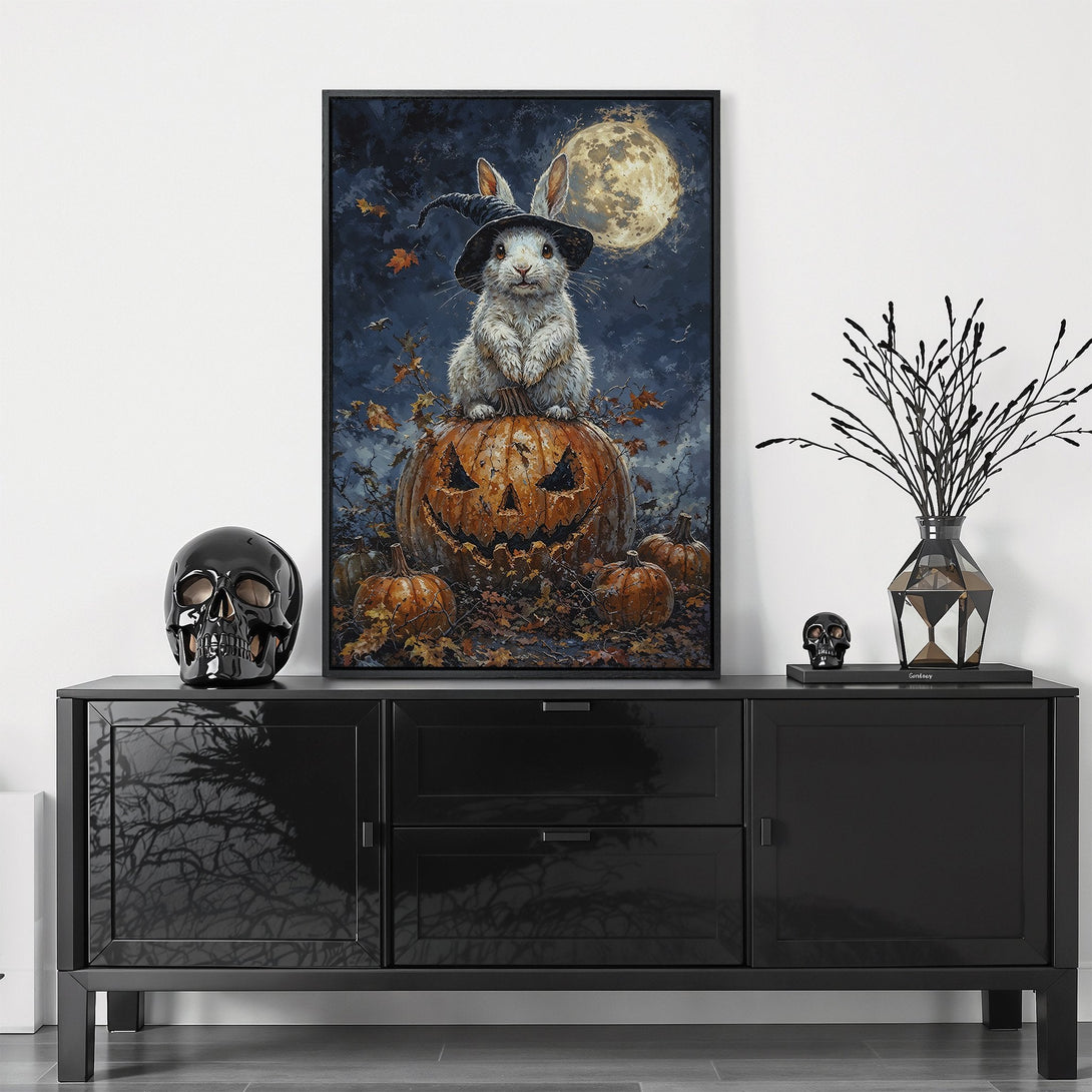Framed Wall Art: Whimsical Halloween bunny on pumpkin. Dark blue, orange, and gold color palette. Perfect for spooky season decor.