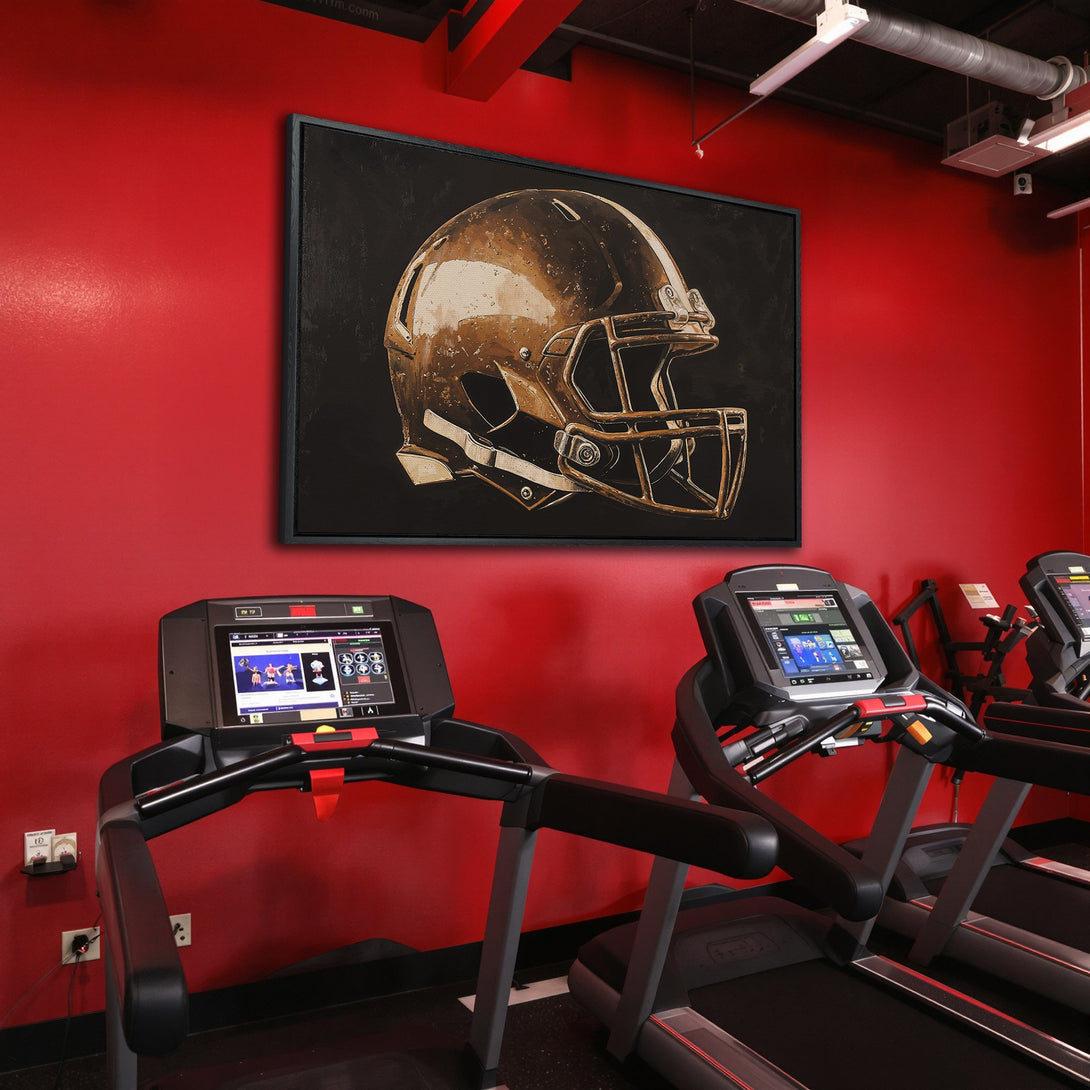 Framed Wall Art: Gold football helmet art in a modern gym. Stylish artwork with a black, gold, and red color palette. Elevate your space!