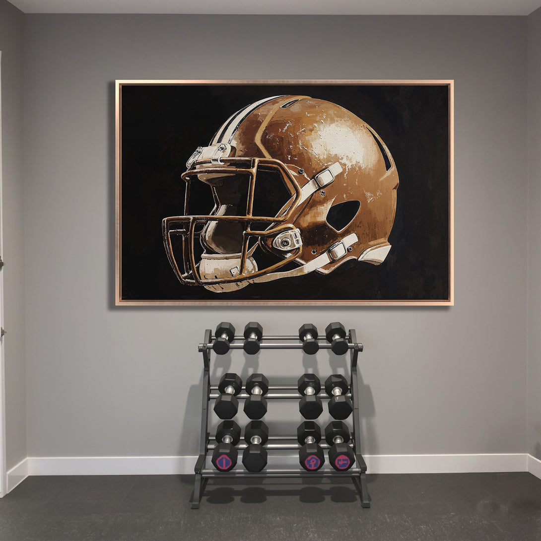 Framed Wall Art: Football helmet canvas print in a gym. Neutral tones with a touch of gold. Perfect for sports fans!
