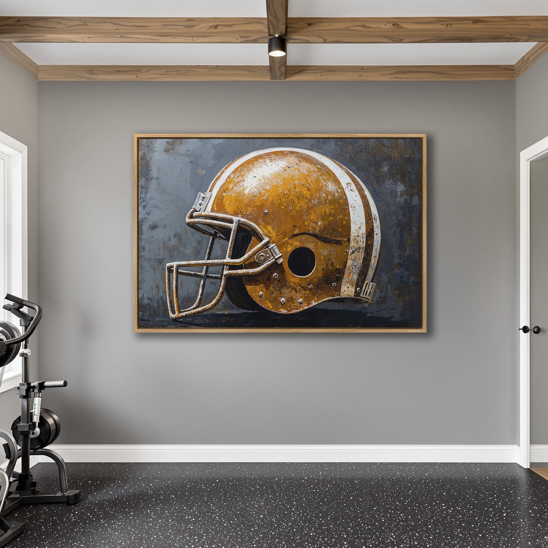 Framed Wall Art featuring a vintage football helmet. Rustic style with a warm, golden yellow and gray color palette. Perfect for a man cave or gym!