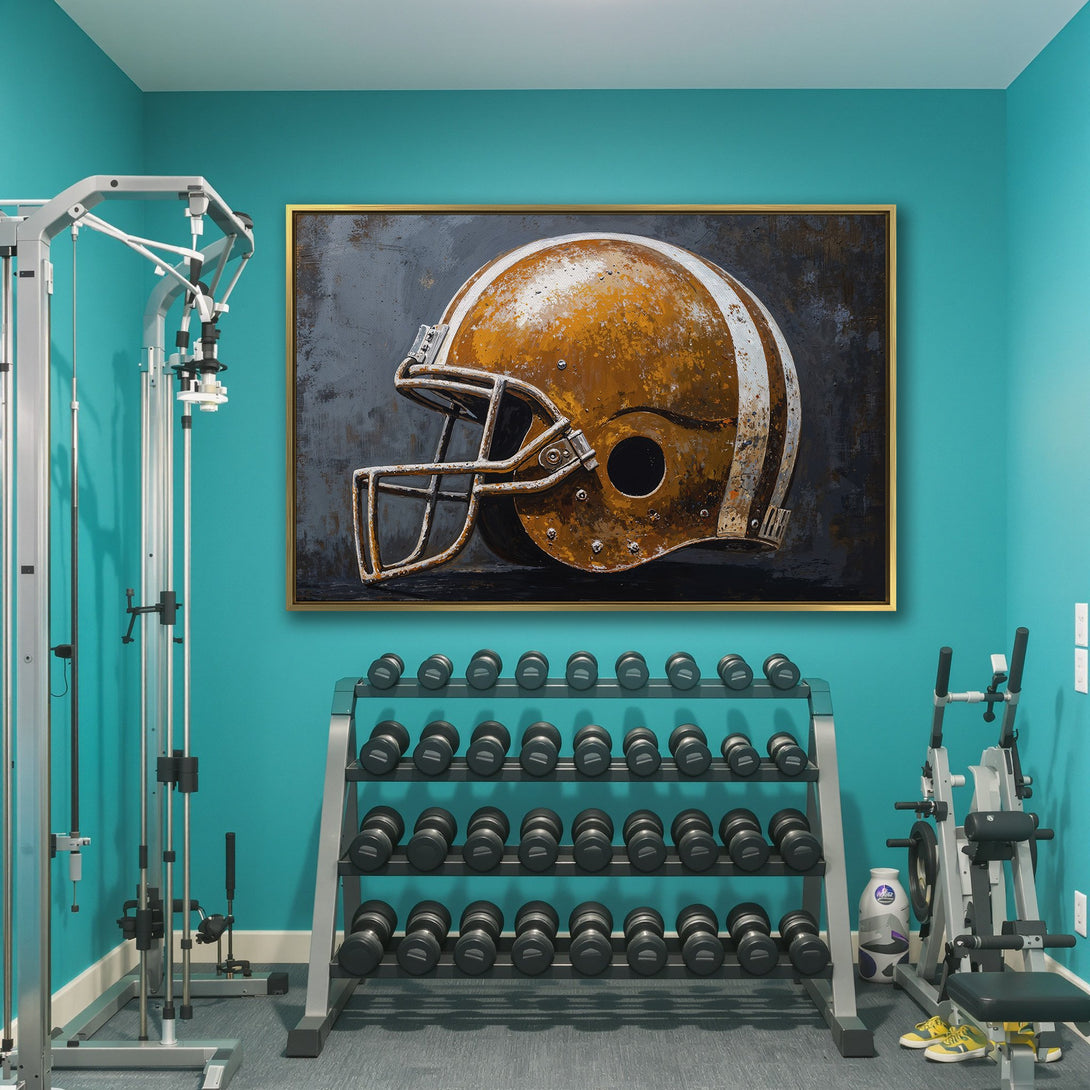 Canvas Print of a vintage football helmet in a gym. Rustic style with a gold and gray color palette. Perfect for sports fans!