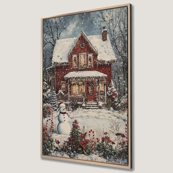 Framed Wall Art: Cozy winter scene Canvas Print featuring a red house, snowman, & snowy landscape. Warm, inviting colors perfect for Christmas decor.