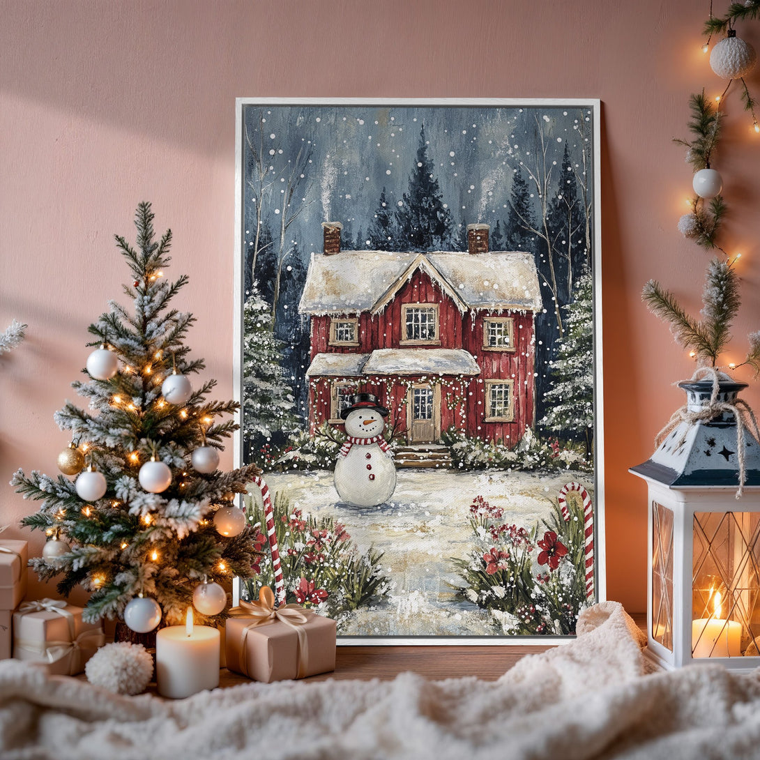 Framed Wall Art: Cozy winter scene Canvas Print with red house and snowman, snowy landscape, and cool blue and red color palette. Perfect holiday decor.