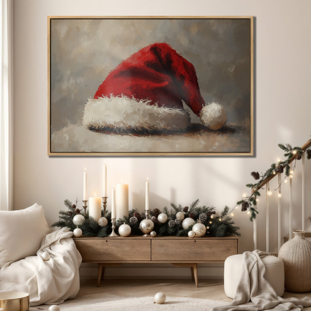 Framed Wall Art: Festive Santa hat painting in red, white, and neutral tones. Perfect Christmas decor for a cozy, stylish interior.