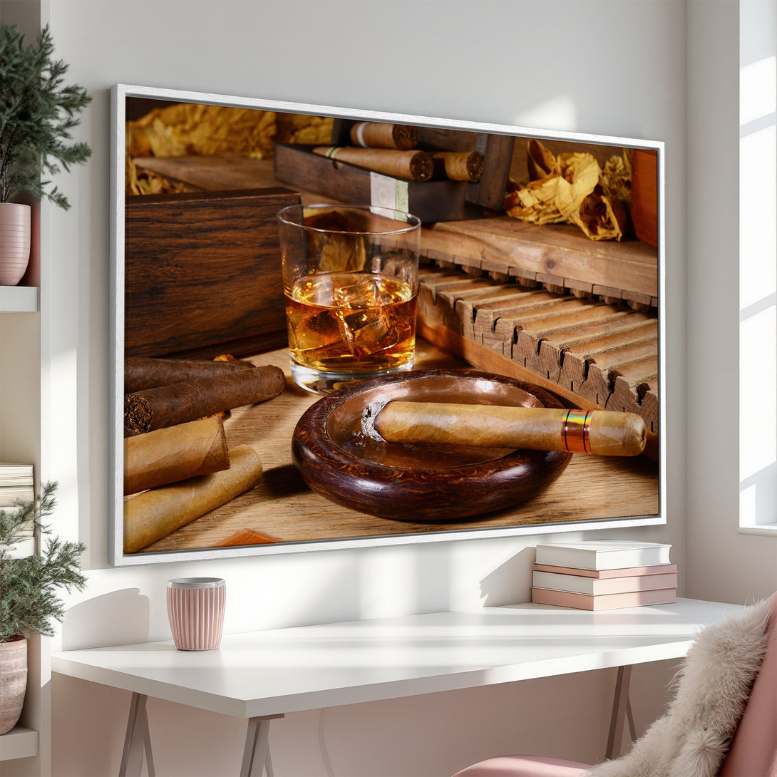 Framed Wall Art featuring a still life of cigars, whiskey, and wood tones. Perfect for adding a touch of luxury to your home decor. Warm, inviting color palette.