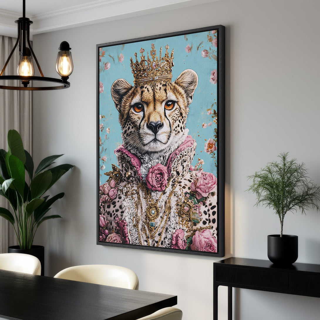 Framed Wall Art featuring a regal cheetah in a crown, floral details, and a light blue background. Stylish decor with pink and gold accents.
